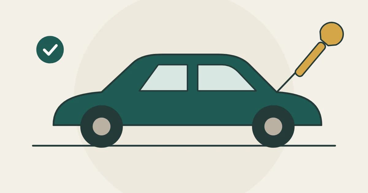 A car with the bonnet open and a spanner